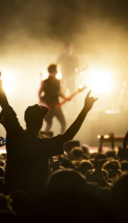 people watching band on the stage